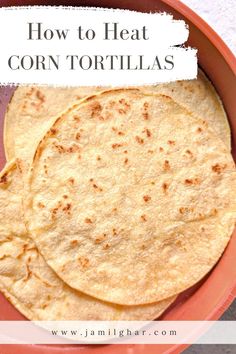 corn tortillas in a bowl with text overlay how to heat corn tortillas