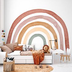 a living room filled with furniture and a rainbow wall mural