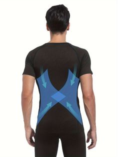 the back of a man wearing a black and blue bodysuit with arrows on it