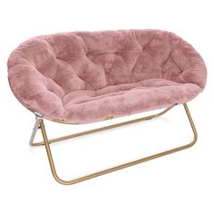 a pink chair sitting on top of a metal frame with a gold frame around it