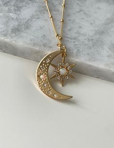 🌙 MATERIALS Moon and Star Charm: 18k Gold filled / Opal Chains: 14k Gold Filled All components are nickel and lead free 🌙 SIZE: Moon charm: 28mm x 18mm Star charm: 18mm x 14mm ⭐️ What is Gold Filled? Unlike gold plated items which have a negligible amount of gold content, gold filled contains a minimum of 5% (1/20) gold by weight pressure bonded over brass. They are tarnish resistant and perfect for those with allergies or sensitive skin. Gold-filled jewelry has 100x more gold alloy than gold Cheap Gold Jewelry With Moon Charm, Celestial Style White Jewelry With Star Charm, Symbolic Gold Jewelry With Star Charm, Celestial Gold Moon Jewelry, 14k Gold Celestial Jewelry With Sun And Moon Design, Celestial Gold Jewelry With Sun And Moon Design, Gold Moon Phase Star Jewelry, Symbolic Sun And Moon Star Jewelry, Gold Celestial Moon Jewelry