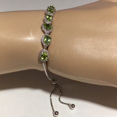 Bracelet Is In Excellent Condition. 3.88 Ctw Peridot And 1.48 Ctw White Zircon Stones. Rhodium Over Sterling Silver (Prevents Tarnish) Bolo Bracelet. Beautiful Sparkly Stones. Adjustable Elegant Lime Green Jewelry, Elegant Adjustable Green Tennis Bracelet, Elegant Green Adjustable Tennis Bracelet, Sterling Silver Bracelet With Green Gemstone, Elegant Silver Peridot Bracelets, Green Sterling Silver Jubilee Bracelet, Bolo Bracelet, Jtv Jewelry, Green Stone