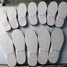 six pairs of foot pads with labels on them