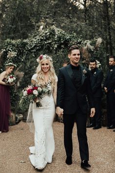 a bride and groom walking down the aisle at their outdoor wedding in front of other guests