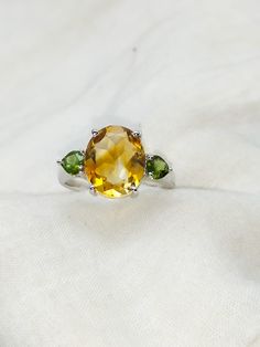 Natural 14K Yellow Citrine Ring - Citrine jewelry-Oval Cut Citrine Wedding Ring-Cocktail Ring-Vintage Ring-November Birthstone-Gift For Her About the Ring:- Gemstones -  Main gemtone-Natural Citrine  Secondary Gemstone- Natural Green Tourmaline Setting - Prong Main Stone Shape - Oval Secondary Stone Shape - Heart If you have any additional questions about this item or need any additional pictures, feel free to message me and I'll be happy to help you out. About us- We are the manufacturers and s Citrine Gemstone Wedding Ring, Oval Citrine Birthstone Ring For Wedding, Oval Vintage Gemstones For Wedding, Oval Citrine Birthstone Ring For Anniversary, Vintage Oval Gemstones For Wedding, Oval Citrine Birthstone Ring With Center Stone, Oval Yellow Birthstone Anniversary Ring, Oval Yellow Gold Birthstone Anniversary Ring, Yellow Oval Birthstone Anniversary Ring