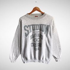 Vintage Studium Big Champ Harvard Cross Usa Grey Sweatshirt Harvard Crewneck Harvard Sweater Print Logo Studium Big Champ Harvard Jumper by brixtonclothing on Etsy Vintage Gray Tops For College, Collegiate Gray Crew Neck Top, Gray Collegiate Crew Neck Top, Vintage Gray Crew Neck Sweater, College Style Crew Neck Cotton Sweater, College Style Cotton Crew Neck Sweater, Casual Cotton Crew Neck Sweater, Vintage Gray Tops With Ribbed Cuffs, Harvard Uni