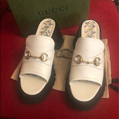 Gucci Dusty White Leather Sandals With Lug Sole And Gold Horsebit Embellishment. With 3 1/4 Inch Heel And 1 1/4 Inch Platform These Shoes Are Comfortable And Stylish. Comes With Dust Bag Box And Tags Full Set. Currently In Stores For $900 Gucci Leather Platform Sandals, Summer Designer Gucci Mules, Chic Gucci Mules For Summer, Chic Gucci Summer Mules, Gucci Sandals With Padded Heel And Round Toe, Gucci Luxury Open Toe Mules, Designer Round Toe Platform Mules, White Gucci Open Toe Sandals, Gucci White Formal Sandals