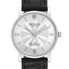 Rolex Cellini Classic White Gold Decorated Silver Dial Mens Watch 5115. Manual winding movement. 18K white gold slim case 32 mm in diameter. 5.5 mm case thickness. Rolex logo on the crown. . Scratch resistant sapphire crystal. Flat profile. Silver dial with baton hour markers and Roman numerals. Guilloche decoration in the center. Black leather strap with 18k white gold tang buckle. Luxury White Stainless Steel Watch, Modern White Chronograph Watch With Metal Dial, Rolex Daytona White Dial, Rolex Day Date White Gold, Rolex White Dial, Cartier Roadster, Rolex Cellini, Used Watches, Rolex Logo