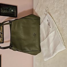 Authentic Coach Handbag. Olive Green, 3 Compartments. 2 Snap Close And Center Is Zip Close. 3 Inside Pockets - 1 Is Zipper. Comes With Dustbag. Nwpt, Never Used. 13 X 11 X 3.5 Coach Handbag, Coach Handbags, Coach Bags, Inside Pocket, Olive Green, Dust Bag, Bag Lady, Zipper, Handbags