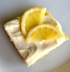 two slices of lemon cake on a white plate