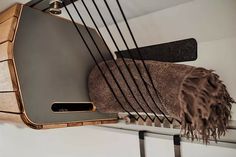 a close up of a metal object on a wall with a blanket hanging from it's side