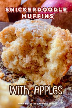 a close up of a muffin with apples in the background