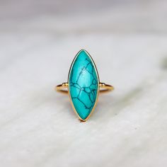 Gold Turquoise Ring | | Natural Copper Turquoise 18k Gold Plated Jewelry | Handmade | December Birthstone | Gold stacking ring | Gift Idea ❥ Metal: Solid sterling silver ❥ US Ring Size: Choose Size ✈ Free Shipping (USPS) ✈ Free Shipping to the United Kingdom 🎁 Free Gift Box ↻ 3 Days Return ⌛ 3 Day Handling Time ❥General Care Instructions ❥Remove jewelry when showering or bathing. This is particularly important when on the beach, in the sea, and in chlorinated water ❥Avoid wearing jewelry when doing physical work such as housekeeping, gardening, or exercise ❥Never expose jewelry to household cleaning products, especially bleach and highly reactive solutions ❥Avoid spraying perfume, or hairspray on the gemstones or pearls as it jeopardizes the integrity of the material ❥Remove jewelry when Copper Turquoise Jewelry, Gold Turquoise Stackable Ring, Stackable Turquoise Ring Fine Jewelry, Elegant Stackable Turquoise Open Ring, Stackable Turquoise Ring In Fine Jewelry Style, Elegant Stackable Open Turquoise Ring, Fine Jewelry Turquoise Birthstone Ring, Elegant Turquoise Gemstone Stackable Rings, Elegant Turquoise Stackable Gemstone Rings