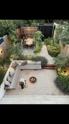 an aerial view of a backyard with seating and trees