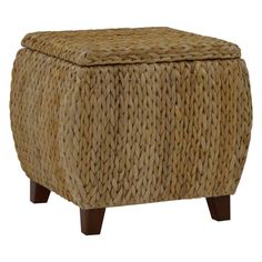 an ottoman made out of woven material with wooden legs and foot rest in front of white background