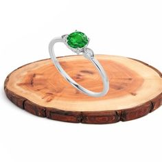 "item description :    this lovely ring is made with pure 925 sterling silver , high quality emerald green diamond is mounted. this ring is made in stacking and minimal format that gives your finger awesome looks since ring is so cute so it is very good gift  your loved ones   Metal : 925 Sterling Silver , our all item are made with solid 925 silver and nickle free so they are skin               friendly.  Stamp : 925  gemstone : created Emerald  birth month : May.    stone size : 6 MM Approx.  Ring size : go to listing drop down menu.  Plating : you can also select GOLD and ROSE GOLD plating for this please go to the Personalisation section.  EMERALD METAPHYSICAL PROPERTY  : Emerald is a life-affirming stone. It opens the heart chakra and calms the emotions. It provides inspiration, balan Dainty Green Solitaire Diamond Ring, Green Cubic Zirconia Diamond Promise Ring, Dainty Green Diamond Ring, Emerald Gemstone Engagement Ring, Green Diamond Rings, Emerald Eternity Band, Month May, Filigree Ring Gold, Gemstone Engagement Ring