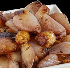 cooked onions in a white bowl on a table