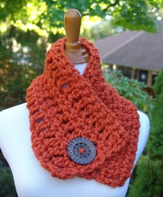 The Ivy Scarf is a beautiful handmade crochet wool blend short cowl scarf in Orange with a functional and fashionable jumbo wood button closure that's perfect accessory for any season or outfit!  Because of the loose pattern, the scarf can be buttoned anywhere along the length of the scarf. It can be worn snug around the neck for warmth or in a looser cowl fashion by adjusting the button - the possibilities are endless! Pair this cowl with jeans or your fanciest work outfit.  The scarf dimensions are 7 inches wide and 32 inches long. Perfect for a special gift or as an individual treat! As with most of my items, this can also be made to order in other sizes and colors. Just let me know if you would like specific measurements, colors or/and buttons. If you would like to see more of my items Fancy Work Outfits, Crochet Short, Crochet Wool, Scarf For Women, Cowl Scarf, Chunky Crochet, Pumpkin Orange, Handmade Crochet, Womens Scarves