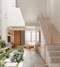 an open floor plan with stairs leading up to the living room