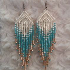 Turquoise Beaded Dangle Chandelier Earrings, Turquoise Dangling Beaded Earrings, Turquoise Earrings With Beaded Fringe, Turquoise Beaded Chandelier Earrings With Round Beads, Elegant Turquoise Beaded Earrings, Elegant Turquoise Beaded Earrings With Tiny Beads, Turquoise Tassel Earrings With Colorful Beads, Turquoise Tassel Drop Earrings With Colorful Beads, Elegant Turquoise Beaded Fringe Earrings