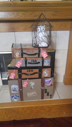 several suitcases stacked on top of each other in front of a fireplace with stickers