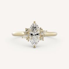 an oval diamond ring with three pear shaped diamonds