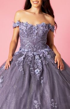 With this stunning Long Ball Gown Quinceanera Floral Dress, elevate your quinceanera. The sweetheart neckline, which is embellished with exquisite lace and flower appliqués, lends a touch of classic charm while the off-shoulder shape oozes grace. You will stand out as the belle of the ball thanks to the layered glitter tulle skirt, which gives a touch of enchantment. With this magnificent gown that flawlessly combines traditional and modern style, you can make your wedding day really spectacular Purple Tulle Gown For Quinceanera, Purple Tulle Ball Gown For Quinceanera, Purple Tulle Ball Gown Quinceanera Dress, Purple Butterfly Ball Gown, Purple Floral Ball Gown, Rental Wedding Dresses, White Dress Styles, Red Quinceanera Dresses, Long Sleeve Homecoming Dresses