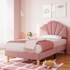 a bedroom with pink walls and flooring has a bed in the middle, an animal toy on the rug next to it