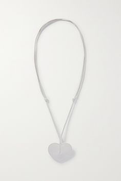 Alaïa's keyring is shaped like its signature 'Le Coeur' bag. Crafted from smooth leather, it hangs from an adjustable strap and is stamped with a silver-tone version of the brand's logo. Metal Rings, Smooth Leather, White Leather, Women Collection, Luxury Design, Porter, Adjustable Straps, Silver Tone, Stamp