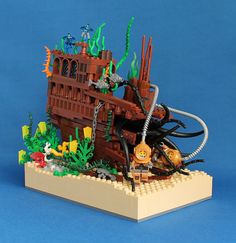 a lego model of a pirate ship with lots of fish and sea creatures on it