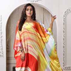 "Trendy long Kaftan made of noble silky satin fabric in milky white canvas and upbeat colours is what you need to flaunt on your next vacation. Egyptian inspiration and varied colours add a royal touch to this Kaftan. The abstract print in various colour is like cherry on the cake. This free-flowing Kaftan is designed with all elements of luxury, grace and elegance. One size fits (Small To 8XL) Fabric :- Silky Satin ( The fabric is totally soft, cool, not stick to the body) * Regular Kaftan Leng Elegant Yellow Silk Kaftan, White Silk Maxi Gown, White Silk Maxi-length Gown, White Silk Maxi Length Gown, Elegant Multicolor Kaftan For Eid, White Floor-length Summer Kaftan, White Wedding Kaftan For Summer, White Satin Summer Gown, White Bohemian Silk Kimono