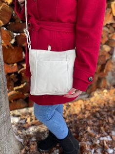 "The Emily style is one of our most popular styles, a medium sized purse with an adjustable strap. Long enough to do the crossover or can be shortened to tuck under the arm on one shoulder. It has two outside pockets that are fully lined, one a zipper on one side and an open pocket on the other. The main section has three slide-in sectional pockets, one being a pen pocket, and on the other side is a zippered pocket. It comes with a magnetic key snap, so you always know where your keys are. We of Versatile Cream Leather Satchel, Cream Shoulder Bag For Everyday Fall Use, Versatile Cream Hobo Bag For Everyday Use, Classic Cream Hobo Bag For Everyday, Casual Cream Shoulder Bag With Soft Leather, Versatile Cream Leather Shoulder Bag, White Shoulder Bag For Everyday Use In Fall, Casual Cream Shoulder Bag In Soft Leather, Fall Leather Shoulder Bag With Cell Phone Pocket