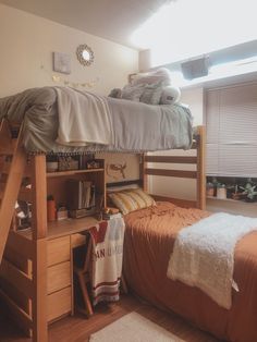 a bunk bed sitting next to a wooden desk