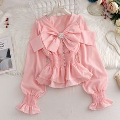 Women's Bowknot Decorated V-neck Puff Sleeves Ruffled Hem Fashion Shirt on Luulla Pink Lantern Sleeve Tops With Ruffles, Pink Ruffled Lantern Sleeve Tops, V-neck Top With Bow For Spring, Spring V-neck Top With Bow, Spring V-neck Top With Bow Detail, Cute Spring Blouse With Bow, Summer Bow V-neck Top, Casual Puff Sleeve Tops With Bow, Spring Long Sleeve Top With Bow