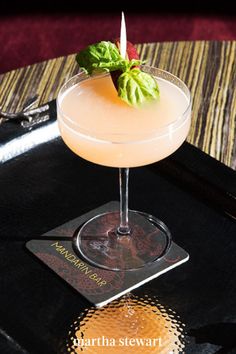 a drink sitting on top of a black tray