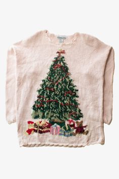 a white sweater with a christmas tree on it