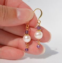 Genuine Freshwater Pearl Earrings with Amethyst gemstone accent - Authentic white Pearl Jewelry - Handmade Earrings - Pearl is June's Birthstone and Amethyst is the February Birthstone - Everyday Earrings - Gold-plated ear wire and spacer beads - Multiple options: (1)  8mm round white Freshwater Pearls with 3mm Amethyst gemstone accents & dangles - Overall earring length is 1.45 inches (81) (2)  8mm rice shaped white Freshwater Pearls with 3mm Amethyst gemstone accents & dangles - Overall earring length is 1.5 inches (80) (3)  9mm flat round white Freshwater Pearls with 3mm Amethyst gemstone accents - Overall earring length is 1.4 inches (82) (4)  10mm flat round white Freshwater Pearls with 3mm Amethyst gemstone accents - Overall earring length is 1.25 inches (84) (5)  8mm round white Fre White Amethyst Jewelry Gift, Gift White Amethyst Jewelry, White Pearl Jewelry, Dichroic Glass Earrings, Holiday Earring, Swarovski Crystal Earrings, Earrings Inspiration, Shell Pendant, Shell Earrings