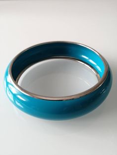 "Blue Turquoise  Bangle Bracelet With Gold Trimming, Rounded Blue  Women's Bracelet, Fashion Custom Jewelry  Blue turquoise women's bangle with a gold trimming.  Great addition to your jewelry collection.    Measurements: Circumference 8.5\" Width: 1/2 inch" Womens Bangles, Metal Style, Turquoise Blue, Womens Bracelets, Custom Jewelry, Bangle Bracelets, Cuff Bracelets, Jewelry Collection, Jewelry Bracelets