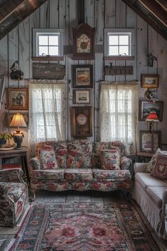 a living room filled with furniture and lots of pictures on the wall next to windows