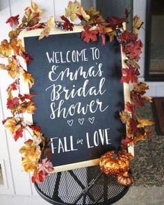 a chalkboard sign that says, welcome to the bride shower and fall in love