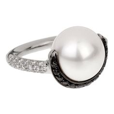 A pearl and diamond ring adorned with round brilliant cut diamonds, and round brilliant cut diamonds encasing the pearl are set in platinum ~ Chanel, c. 2000 Ashtar Command, Vintage Chanel Jewelry, Chanel Black And White, Chanel Pearl, Chanel White, Chanel Pearls, Bracelet Design, Chanel Jewelry, Beaded Anklets