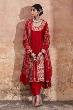 Red anarkali with placement peacock motif embroidery. Paired with a plain straight pant and a dupatta with bandhani print and attached coin at hem. - Aza Fashions Red Art Silk Anarkali Set With Mirror Work, Red Anarkali Set With Mirror Work In Art Silk, Red Silk Anarkali Set With Mirror Work, Red Anarkali, Red Peacock, Peacock Motif, Bandhani Print, Motif Embroidery, Red Kurta