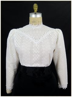 "100% Cotton. Color: White. Embroidered stripe pattern weave cotton fabric with white poly floral leaf lace trim. Poly trim for collar, cuffs and front bodice, classic Edwardian design. Lightly gathered full length sleeves with button back. Generously cut for comfort. Machine washable. Circa 1898-1910. Made in U.S.A. Sizes: SM, MED, LG & XLG. Blouses ordered by bust measurement, inches: BUST SIZES 32\" - 34\" SMALL 35\" - 39\" MEDIUM 40\" - 44\" LARGE 45\" - 49\" XLARGE Blouses ordered by bu Classic Tops With Lace Collar, Fitted Cotton Blouse With Lace Sleeves, Classic Blouse With Lace Cuffs For Daywear, Elegant Broderie Anglaise Blouse For Fall, Classic White Tops With Lace Work, Classic White Lace Tops, Classic Formal Tops With Lace Sleeves, Formal Classic Tops With Lace Sleeves, Formal White Lace Work Blouse