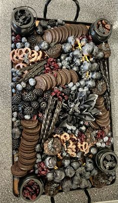 a piece of art made out of various objects on the ground and in front of it