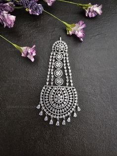 Stunning American diamond pasa or hair jewelry made with highest quality cubic zirconia stones. High quality silver plating. Length  - 4.5 Inches Width - 2 Inches Style Tip: Wear with statement earrings or a full CZ necklace set to add glamour to your wedding lehenga. ----------- CARE ----------- - Store in air tight zip lock bags - Do not expose to moisture/water - Do not spray chemicals or perfumes on the jewelry Please feel free to contact us if you have any questions. * We sell high quality imitation jewelry only. All measurements are approximate. Please note that all sales are final. Thank you Silver Cubic Zirconia Bridal Accessories, Hand Set Silver Diamond Bridal Earrings, Hand Set Diamond Bridal Earrings In Silver, Silver Diamond Bridal Earrings Hand Set, Traditional Silver Bridal Earrings With Cubic Zirconia, Silver Tikka With Cubic Zirconia For Gift, Silver Cubic Zirconia Tikka For Wedding, Silver Cubic Zirconia Tikka For Gift, Silver Cubic Zirconia Tikka As Gift