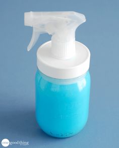 a blue bottle with a white sprayer on it