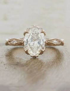 an oval shaped diamond ring with twisted band