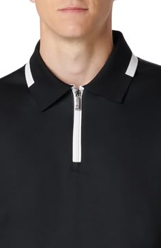 A zippered placket updates a pima-cotton polo tipped with contrast for a sporty look, no matter what game you're playing. Quarter-zip closure Spread collar Short sleeves 100% pima cotton Machine wash, dry flat Imported Polo Shirt Collar, Polo Zipper, Sporty Polo Shirt With Striped Collar For Golf, Sporty Golf Polo Shirt With Striped Collar, Sporty Polo Shirt With Contrast Collar, Sporty Polo Shirt With Contrast Trim, Tshirt For Men, Polo T Shirts For Men, Golf Brands