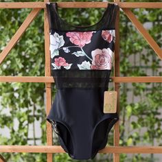 a bathing suit hanging on a wooden rack