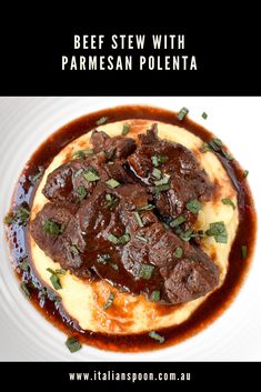 beef stew with parmesan polenta on a white plate